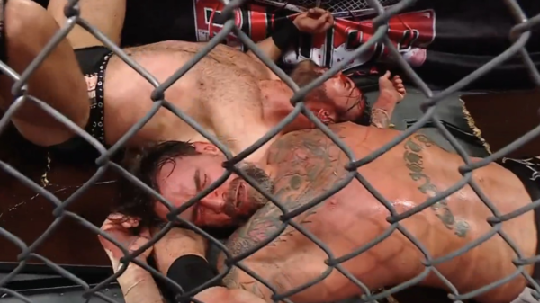 Video: CM Punk survives brutal suplex by way of desk to win bloody match in WWE