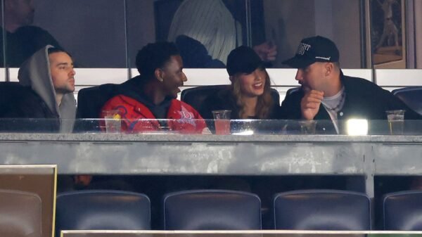 Taylor Swift & Travis Kelce Rock Black Baseball Caps to Recreation 1 Between the New York Yankees & Cleveland Guardians