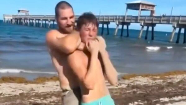 UFC champ Sean Strickland chokes fan at the beach