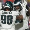 Jalen Carter’s teammates celebrate his new contract